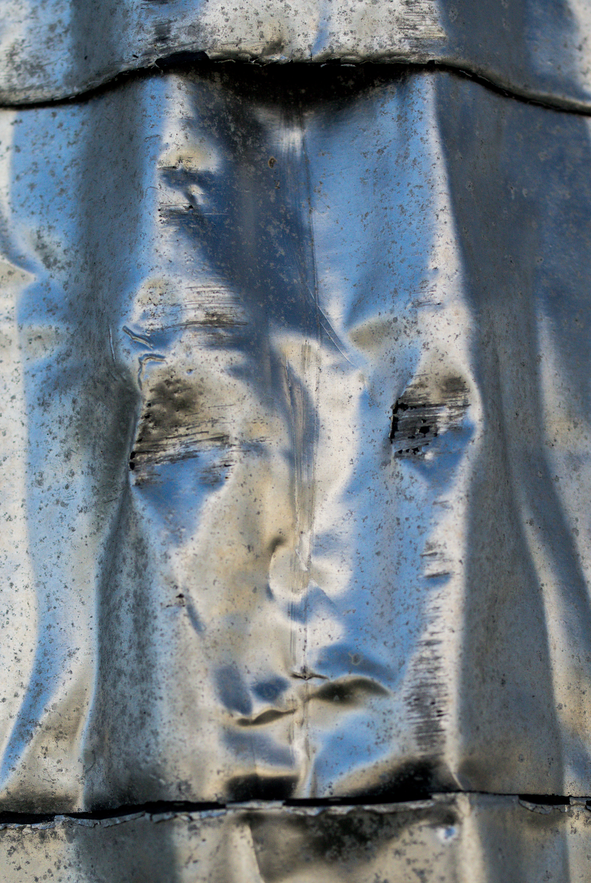 Face in crumpled sheet metal, Beaufort, North Carolina (2012)