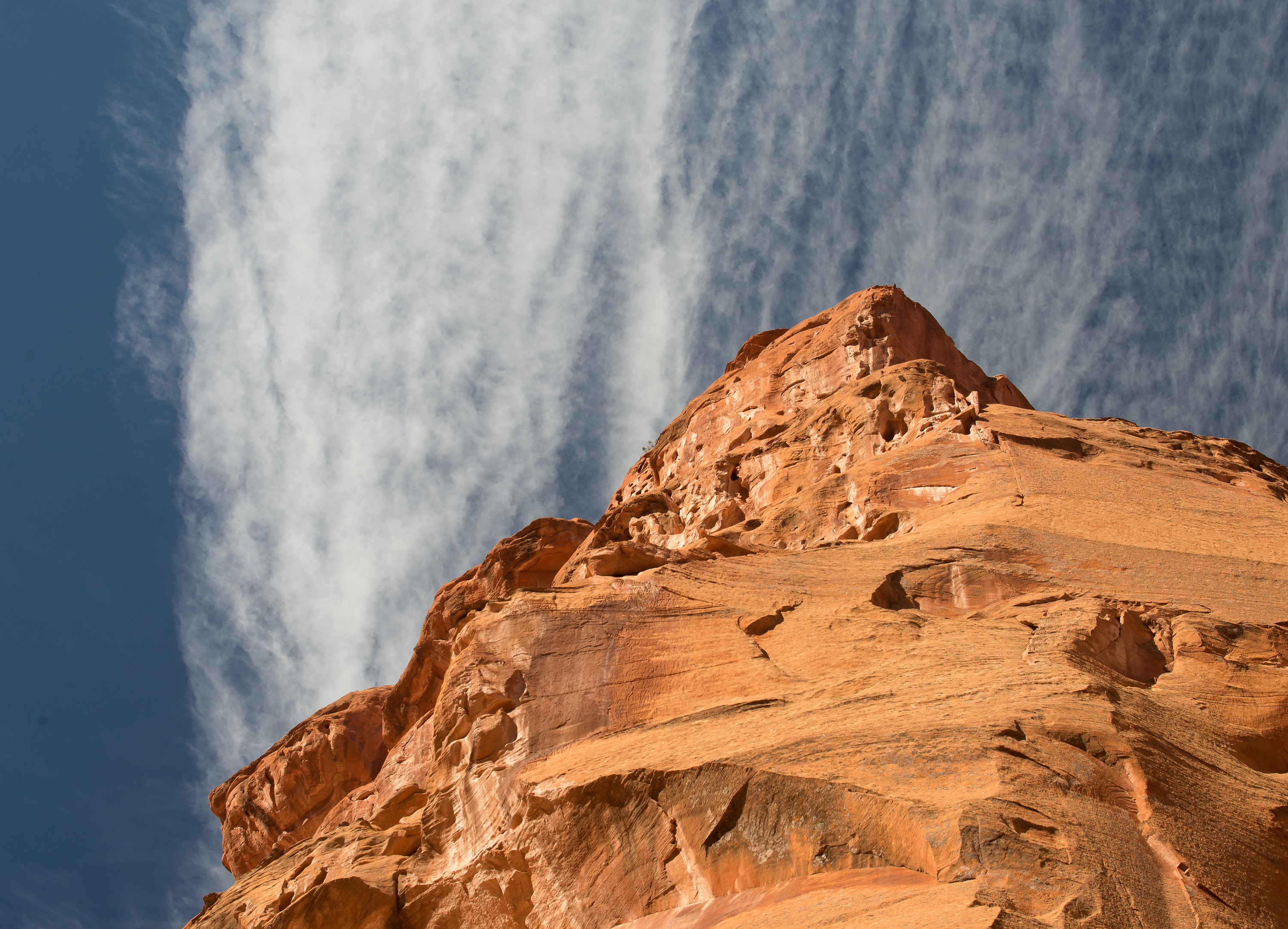 Sandstone cliff and clouds, near Boulder, Utah (2013)